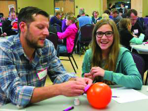 A father and daughter working on an engineering project at a previous parent-daughter engineering day. (Photo provided by the Engineering and Applied Technology College.)